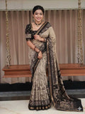 Woman in a traditional saree standing in front of a swing