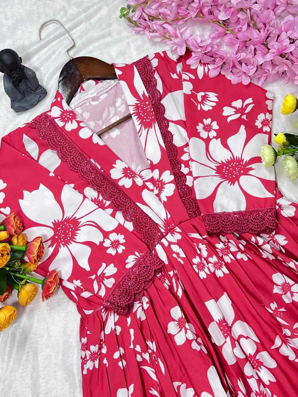 Red floral dress with white flowers on a white background with flowers around