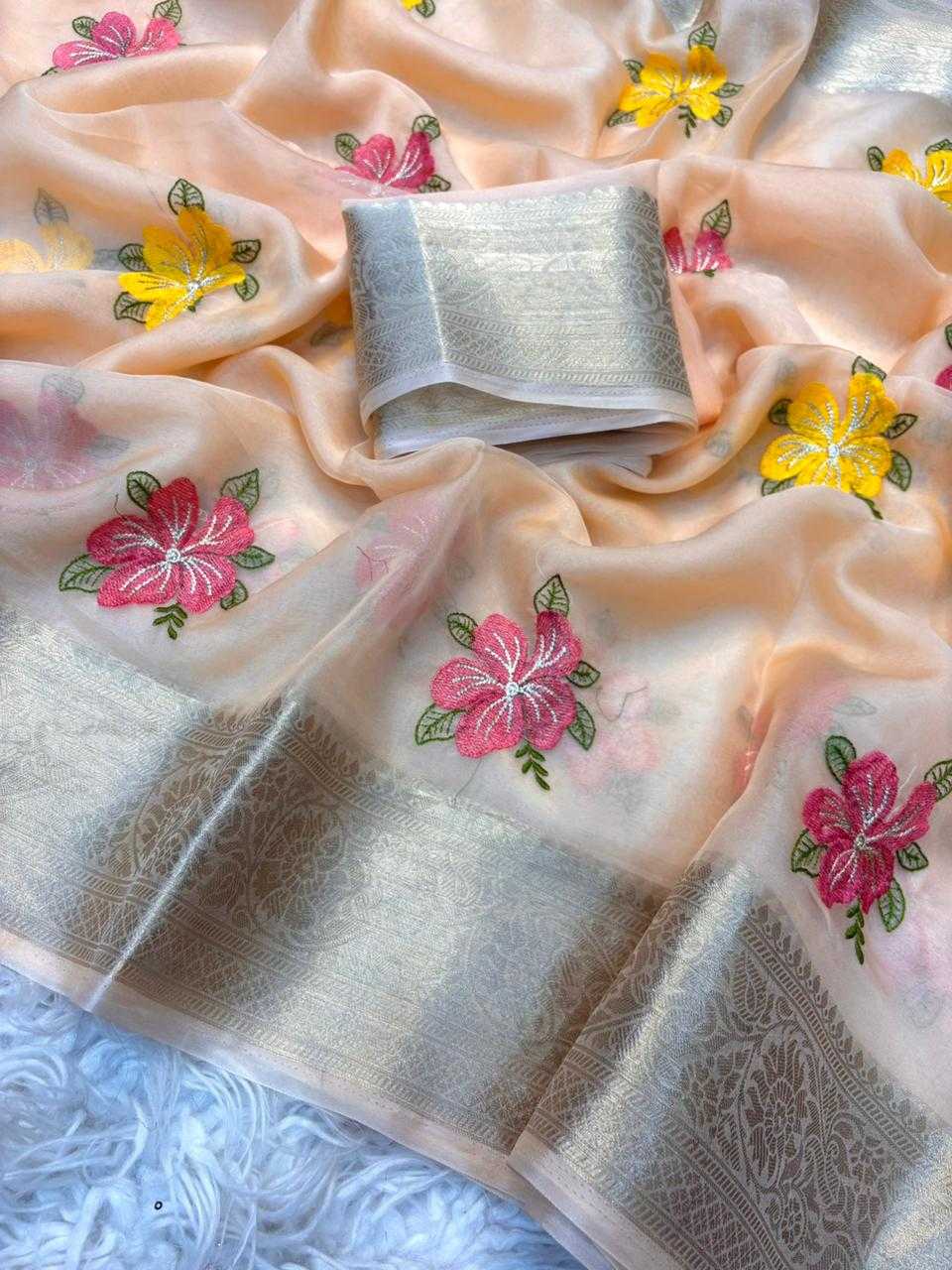 Folded fabric with floral embroidery on a textured surface