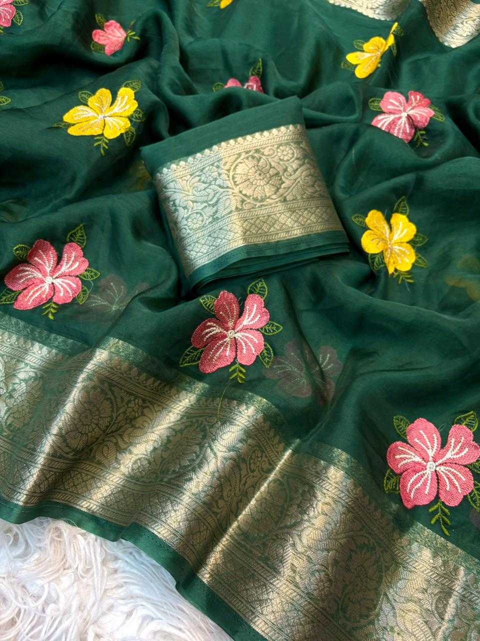 Green saree with floral embroidery and a white blouse