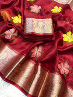 Red saree with floral embroidery and gold border