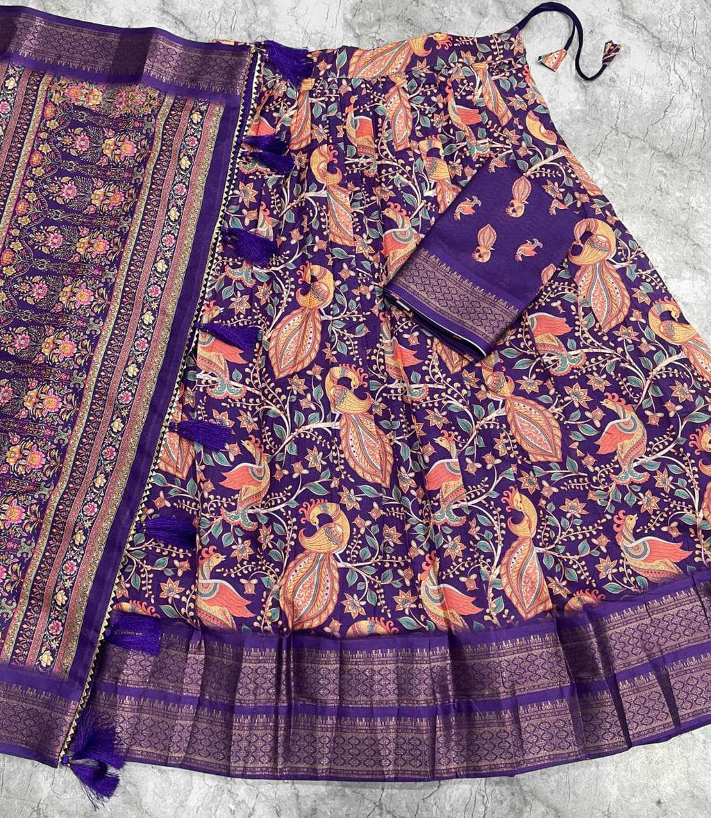 A purple and orange printed fabric set laid flat on a light gray surface, featuring a patterned textile with a matching folded piece and decorative border details.