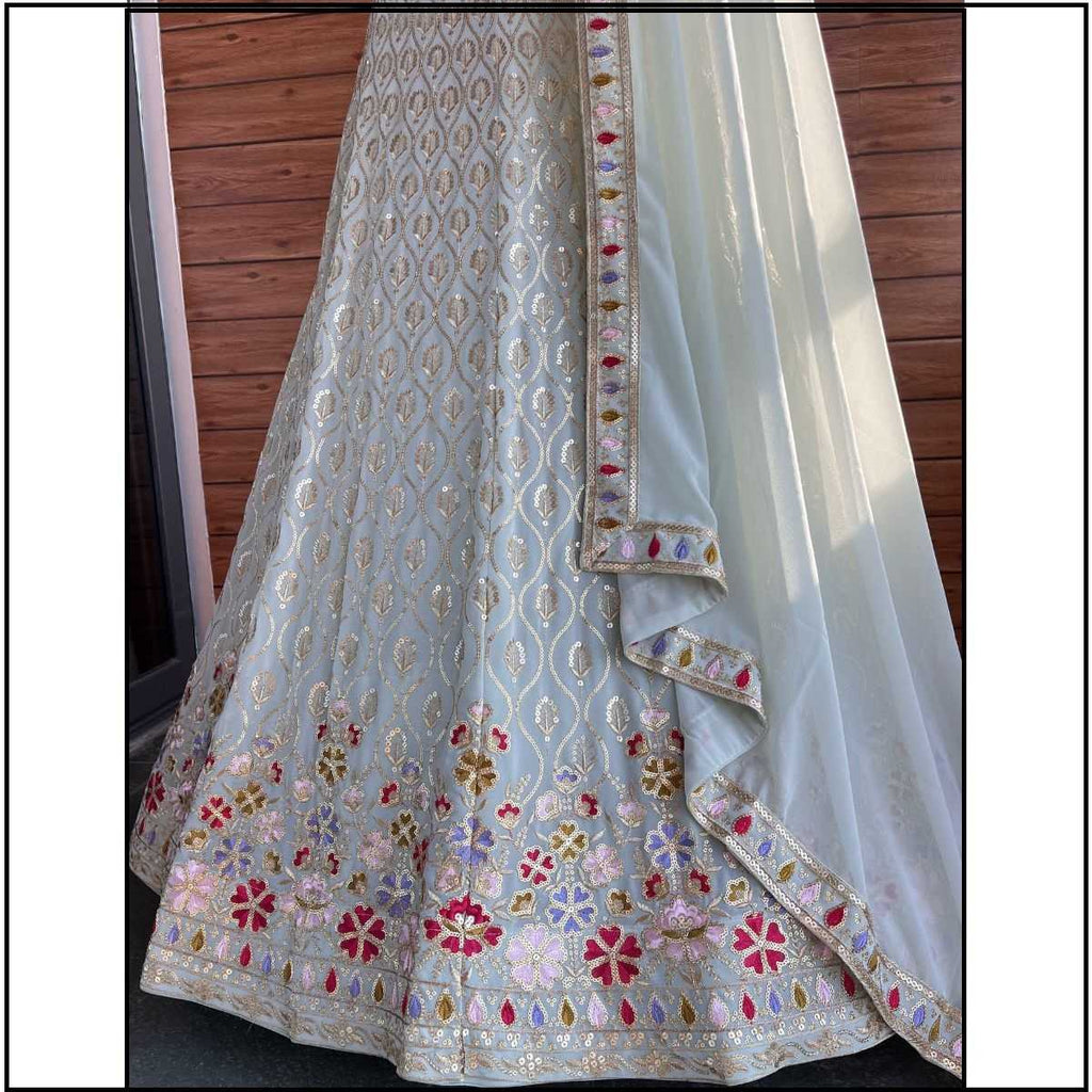 Embroidered fabric with floral patterns on a plain background